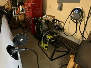 Industrial workshop with electrical equipment, power distribution, cable management, and red toolboxes