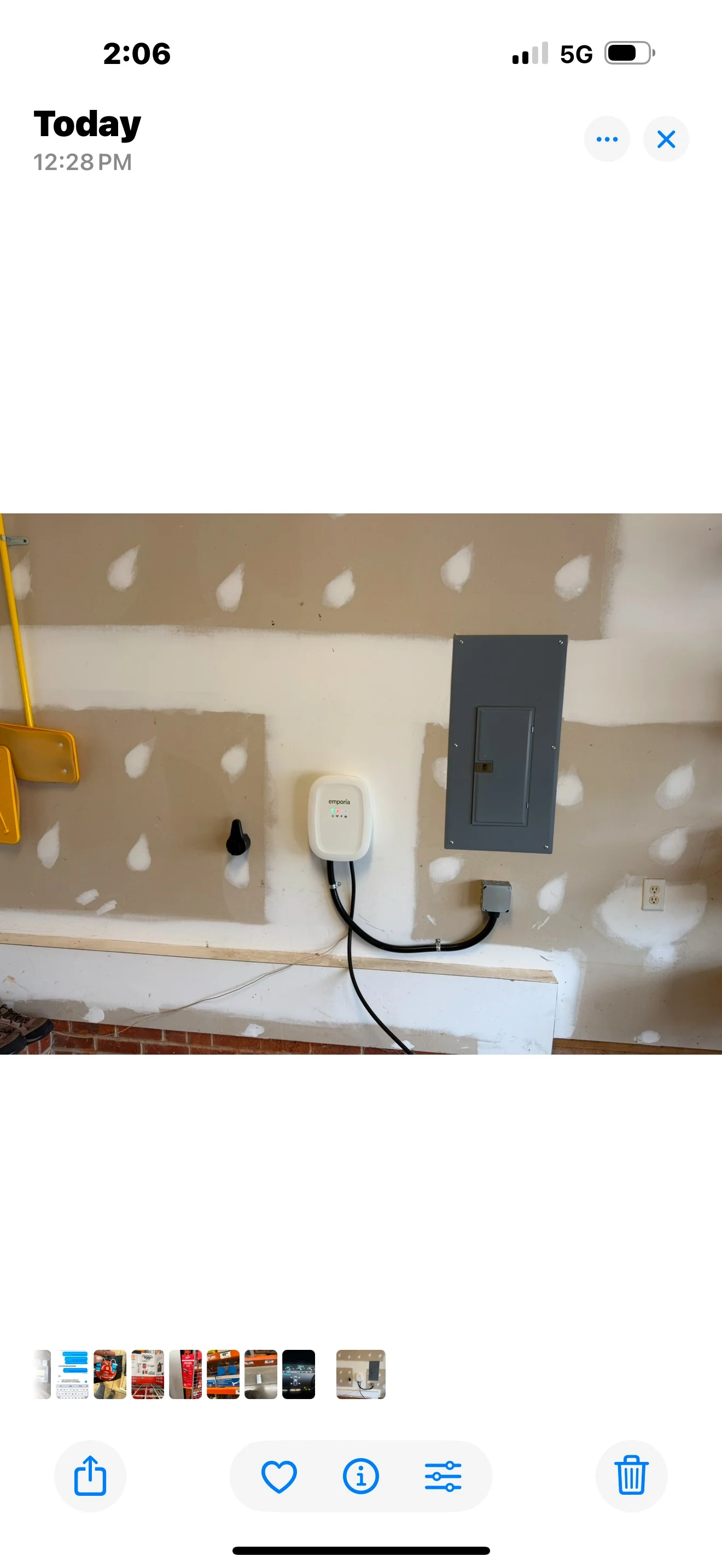Level 2 EV charger installation on drywall with electrical wiring and panel integration